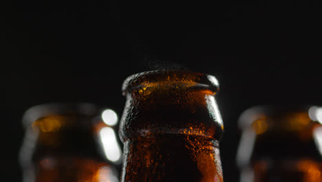 Close-Up-Of-Condensation-Droplets-On-Neck-Of-Bottles-Of-Cold-Beer-Or-Soft-Drinks-With-Water-Vapour-After-Opening-1